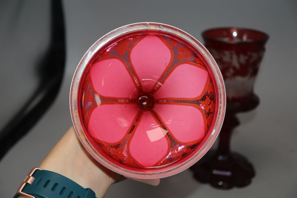 A Bohemian etched ruby glass goblet, together with a gilded cranberry glass vase, tallest 29cm